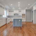 A typical Corrigan luxury kitchen with lots of surfaces to work on and storge spaces to hide things.